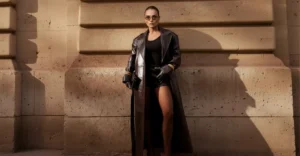 Woman wearing orange lens Selen Eyewear sunglasses in a luxury street portrait