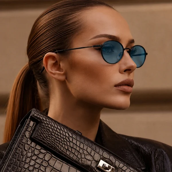Woman wearing blue Selen Eyewear sunglasses in a luxury profile portrait