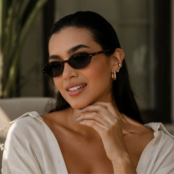 Elegant woman wearing dark brown Selen Eyewear sunglasses