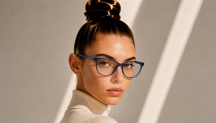 Woman wearing blue Selen Eyewear glasses in warm light