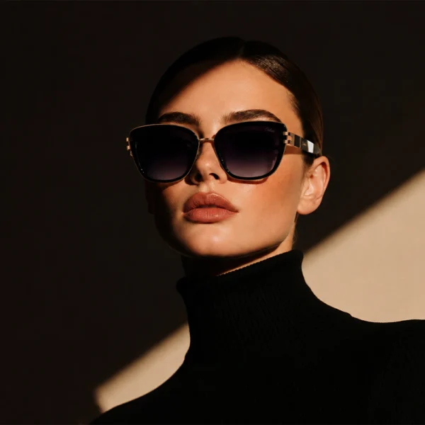 Elegant woman wearing black gold Selen Eyewear sunglasses