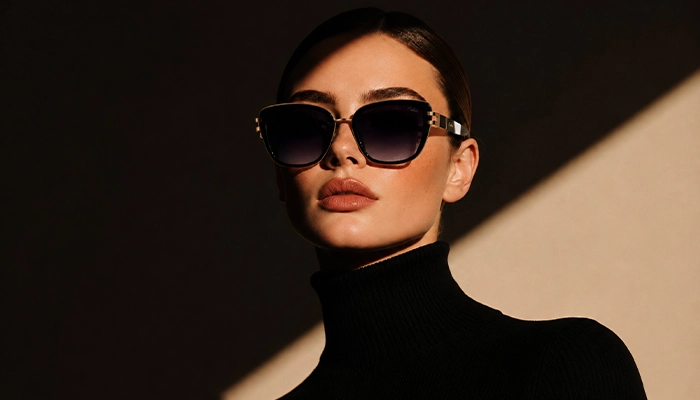 Elegant woman wearing black gold Selen Eyewear sunglasses