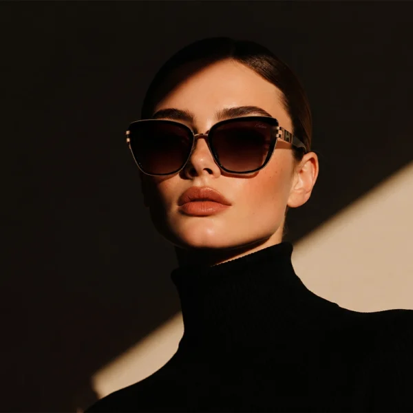 Elegant woman wearing dark brown gold Selen Eyewear sunglasses