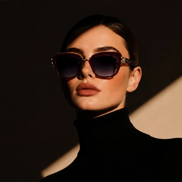 Elegant woman wearing burgundy Selen Eyewear sunglasses
