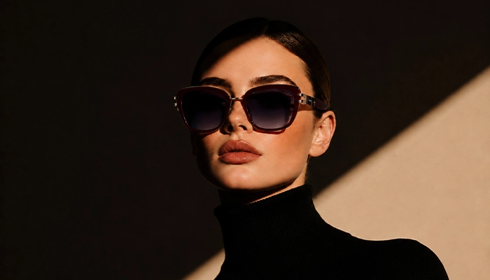 Elegant woman wearing burgundy Selen Eyewear sunglasses