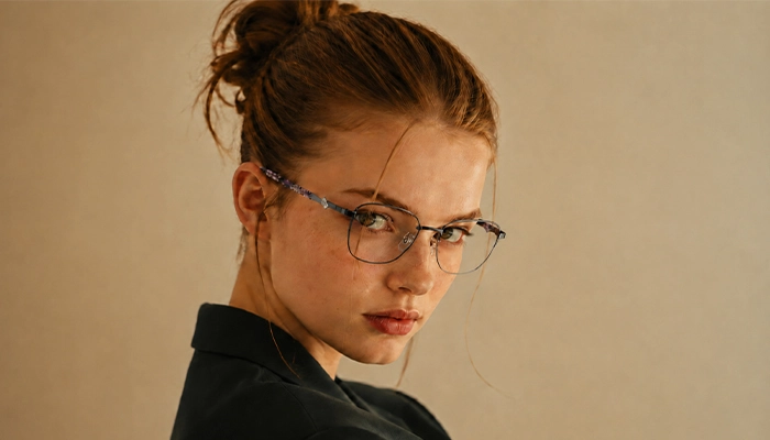 Woman wearing dark geometric Selen Eyewear glasses
