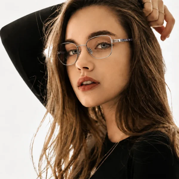 Young woman wearing thin geometric Selen Eyewear glasses