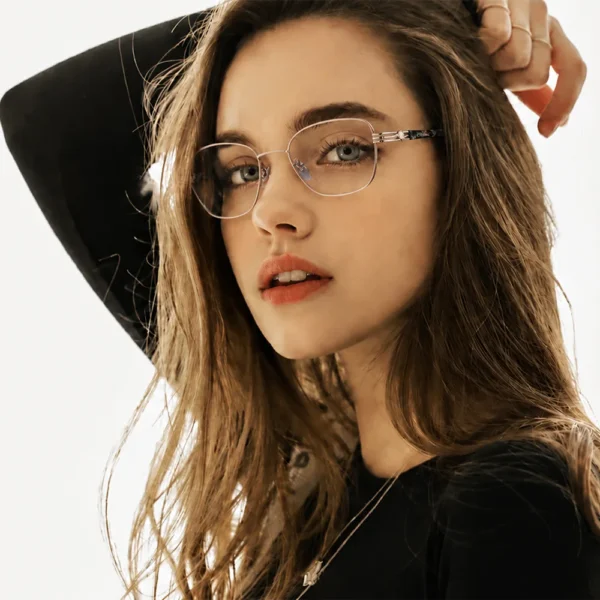 Woman wearing Selen Eyewear full-rim metal optical glasses in a close-up beauty portrait