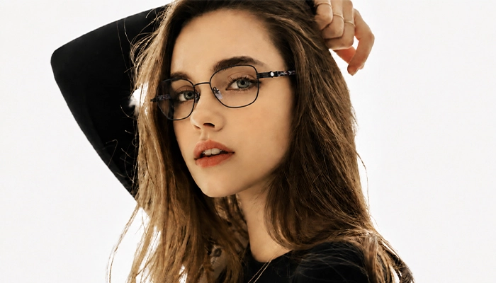 Woman wearing Selen Eyewear full-rim metal optical glasses in a modern fashion portrait