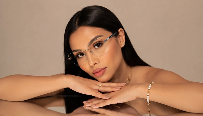 Woman wearing Selen Eyewear full-rim metal optical glasses in a minimalist beauty portrait.