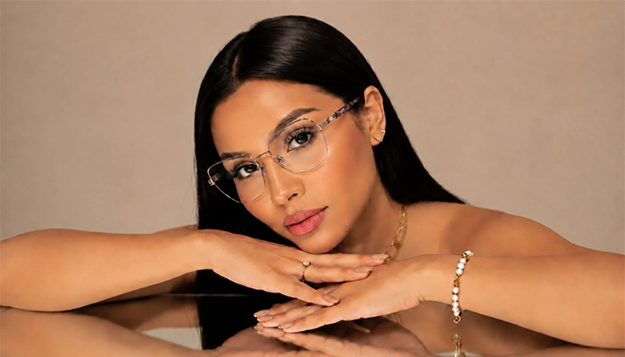 Woman wearing Selen Eyewear full-rim metal optical glasses in a refined studio portrait.
