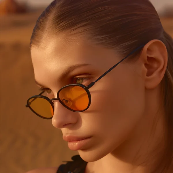 Woman wearing orange lens Selen Eyewear sunglasses in warm light