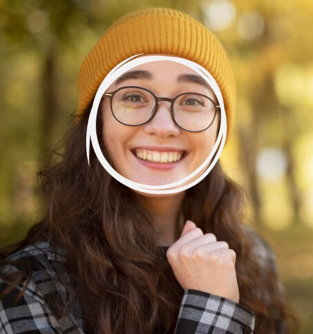 Smiling woman wearing black Selen Eyewear glasses outdoors